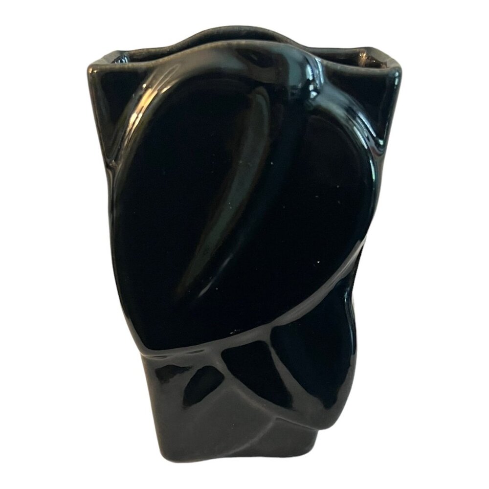 A mid-century Kansas Dryden Pottery black vase with an embossed leaf design 1955